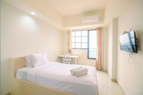 Simply Look Studio at Evenciio Margonda Apartment By Travelio